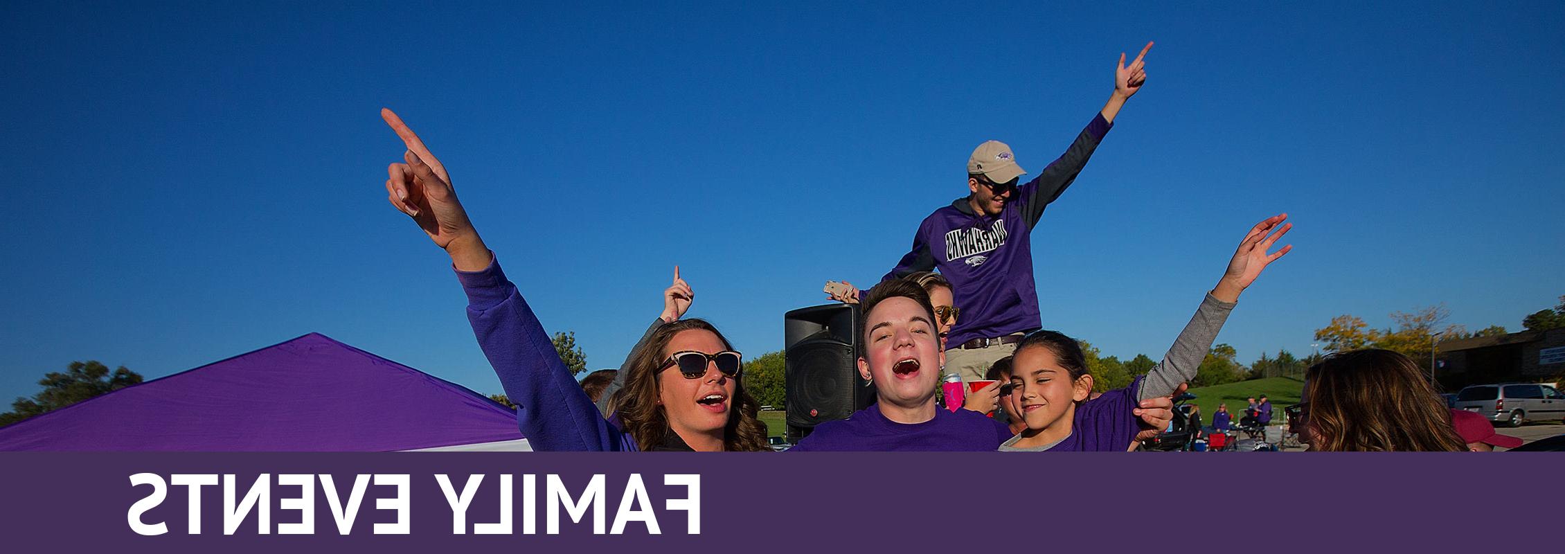 Family Events: A family dressed in purple singing or shouting, arms in the air